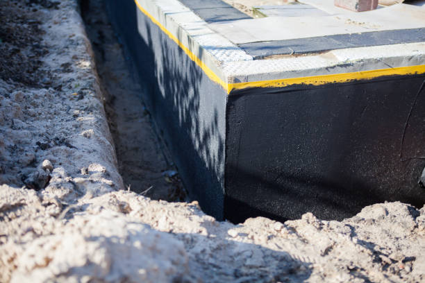 Professional Basement Waterproofing technician working in Columbus, GA